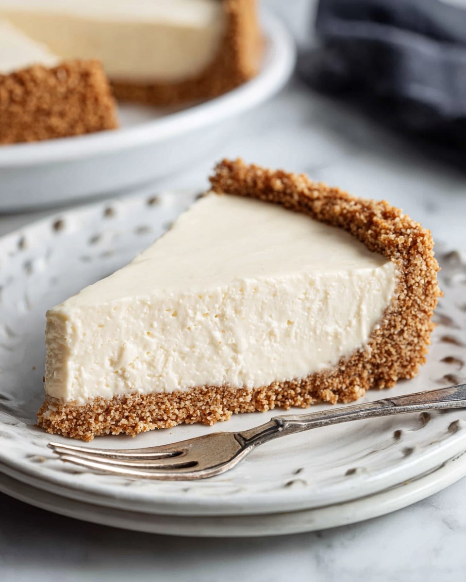 The image shows a slice of pie on a white plate with a cut-out edge pattern, sitting on a white marbled texture. The slice has two main layers: a thick, rough-textured brown crust at the bottom and sides, and a thick, smooth, creamy off-white filling on top. The crust appears crumbly and coarse, while the filling looks soft and dense with a slightly glossy surface. A silver fork rests on the plate next to the pie slice. Photo taken with an iphone --ar 4:5 --v 7